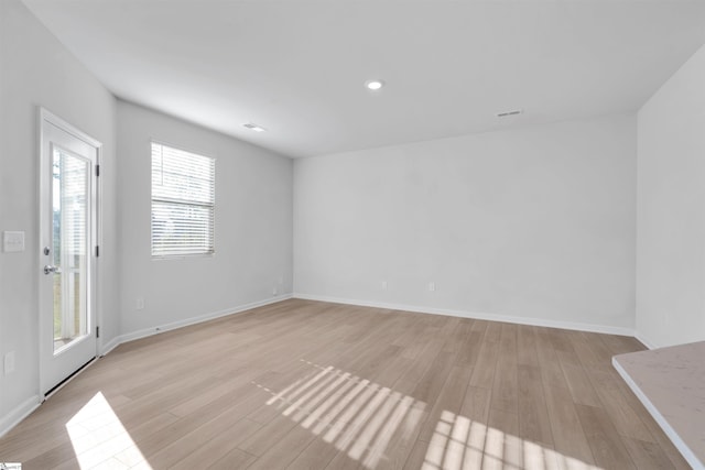307 E Compass Way, Easley, SC 29640 - unfurnished living room featuring light wood-style flooring, baseboards, and recessed lighting