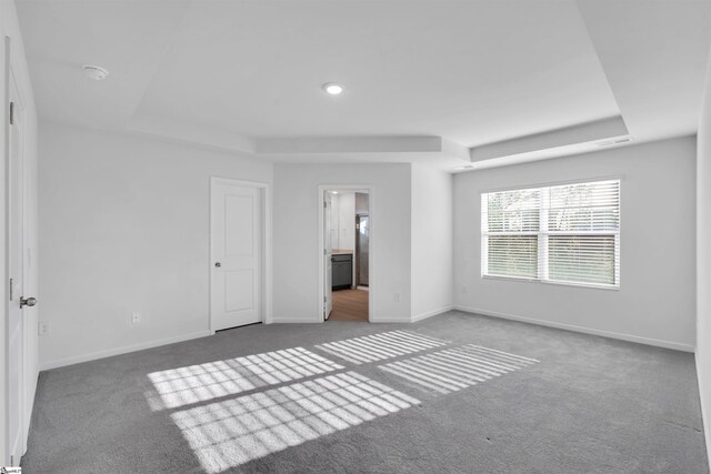 307 E Compass Way, Easley, SC 29640 - unfurnished bedroom with a raised ceiling, carpet flooring, and baseboards