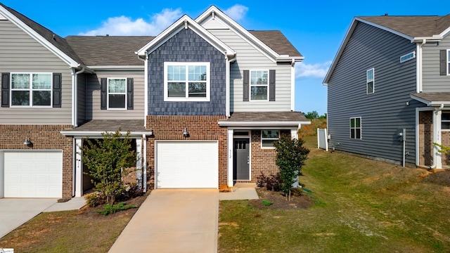 view of front of property featuring brick siding, driveway, and a garage