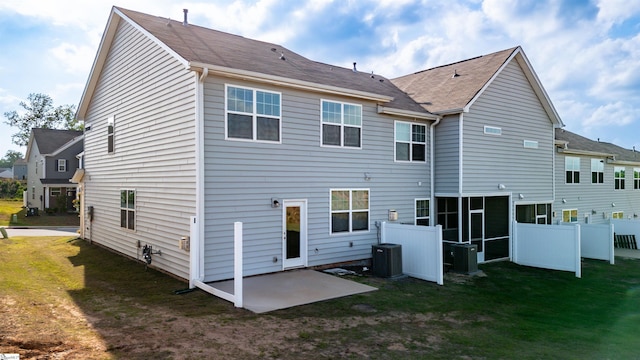 back of property featuring a patio area, central AC unit, and a sunroom