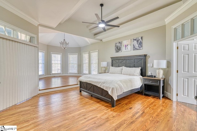 bedroom featuring light wood finished floors, a chandelier, multiple windows, and crown molding