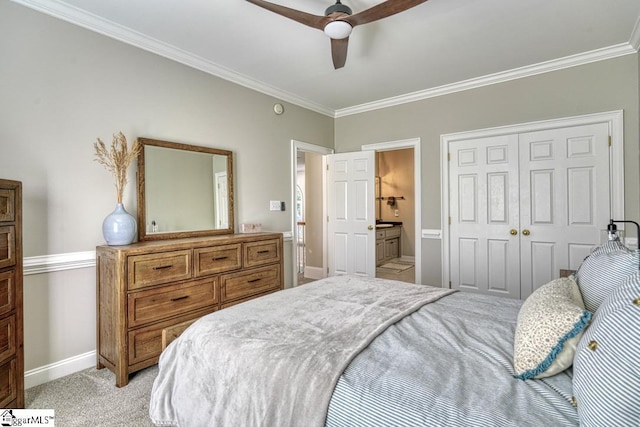 bedroom with baseboards, crown molding, light carpet, a closet, and a ceiling fan