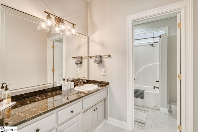 full bathroom with vanity, baseboards, and tile patterned flooring