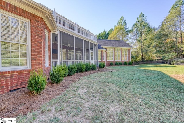 view of yard with a sunroom