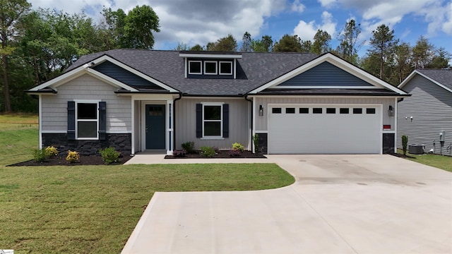 1306 Fairview Rd, Gaffney, SC 29341 - craftsman-style home featuring a shingled roof, an attached garage, driveway, a front yard, and stone siding