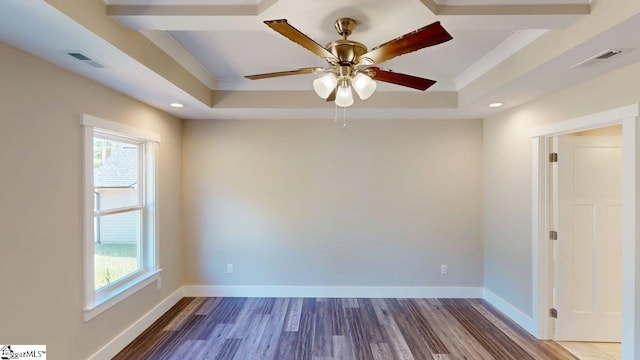 1306 Fairview Rd, Gaffney, SC 29341 - empty room featuring a tray ceiling, healthy amount of natural light, wood finished floors, recessed lighting, and crown molding