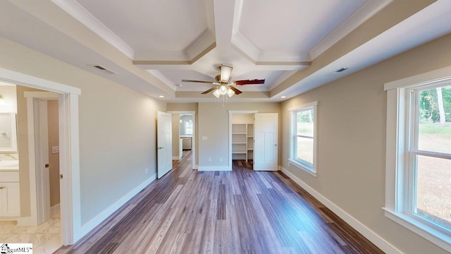 1306 Fairview Rd, Gaffney, SC 29341 - unfurnished bedroom featuring coffered ceiling, a spacious closet, baseboards, wood finished floors, and beam ceiling