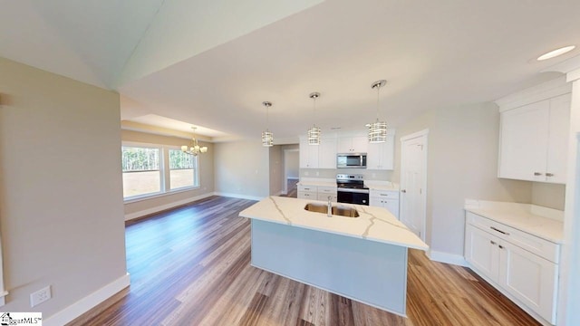 1306 Fairview Rd, Gaffney, SC 29341 - kitchen featuring stainless steel appliances, baseboards, light wood-type flooring, a chandelier, and white cabinets