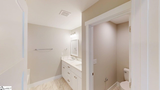 1306 Fairview Rd, Gaffney, SC 29341 - bathroom with toilet, double vanity, baseboards, and marble finish flooring