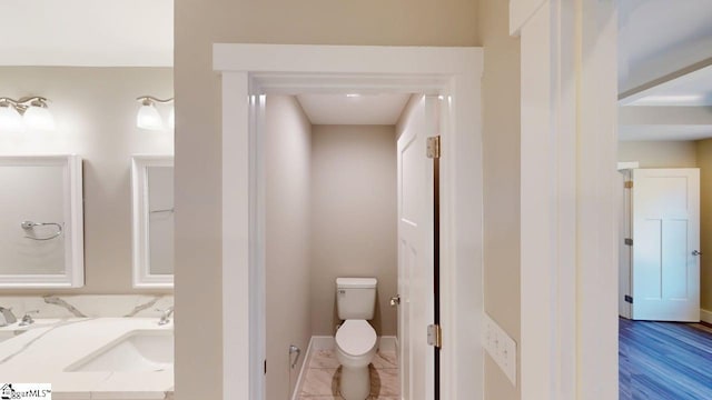 1306 Fairview Rd, Gaffney, SC 29341 - bathroom with toilet, baseboards, and double vanity