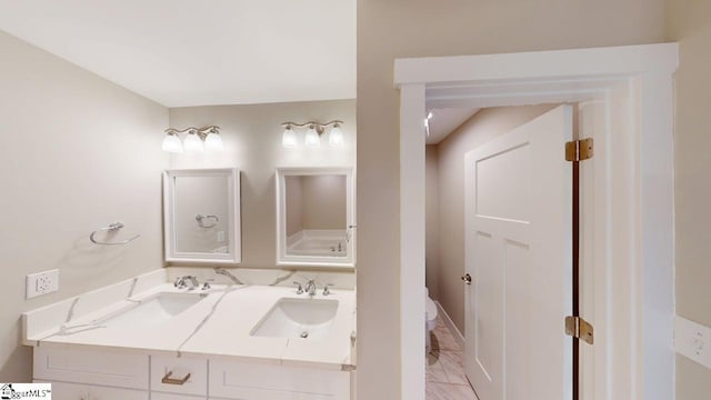 1306 Fairview Rd, Gaffney, SC 29341 - bathroom with marble look tile flooring, double vanity, and baseboards