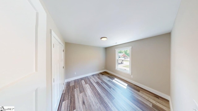 1306 Fairview Rd, Gaffney, SC 29341 - unfurnished bedroom with wood finished floors and baseboards