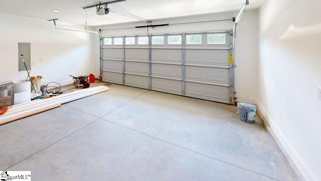 1306 Fairview Rd, Gaffney, SC 29341 - garage with a garage door opener, baseboards, and electric panel