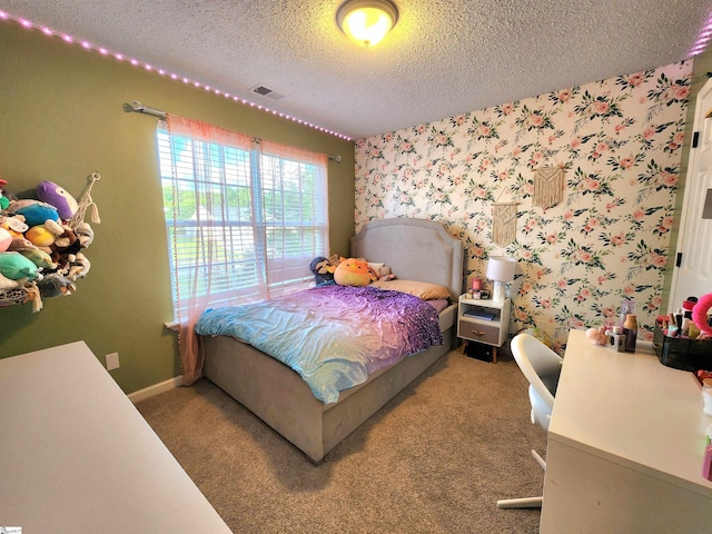 bedroom featuring a textured ceiling, carpet flooring, wallpapered walls, and baseboards