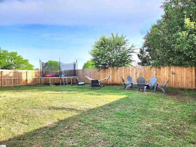view of yard with a trampoline
