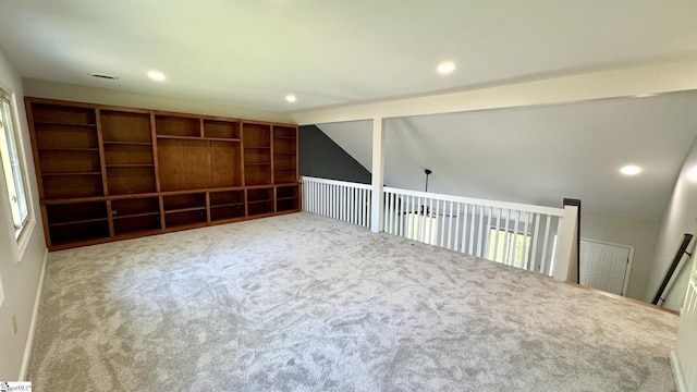 spare room featuring carpet flooring, lofted ceiling, recessed lighting, and plenty of natural light