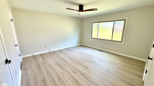 unfurnished bedroom with light wood-type flooring, baseboards, and ceiling fan