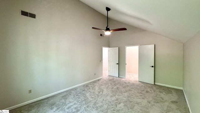 unfurnished bedroom with lofted ceiling, carpet floors, baseboards, and ceiling fan