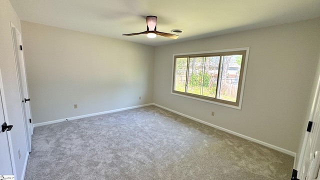 unfurnished bedroom featuring carpet flooring, baseboards, and a ceiling fan