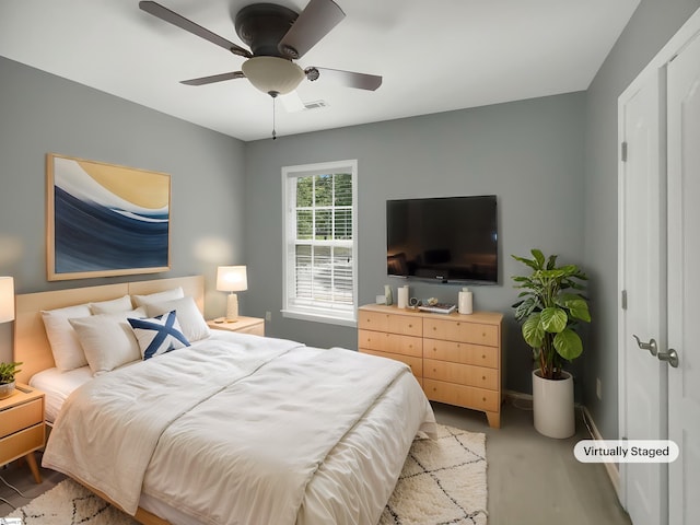 bedroom with baseboards, a ceiling fan, and light wood-style floors
