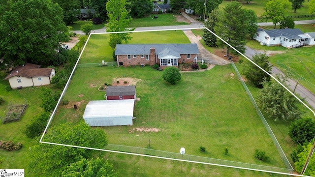 aerial view of property and surrounding area featuring property parcel outlined