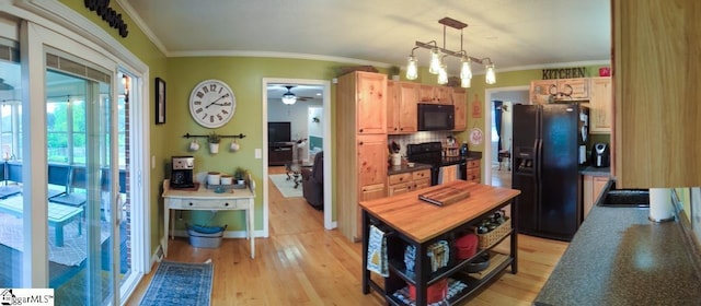 kitchen with black appliances, ornamental molding, light brown cabinets, light wood-style flooring, and a ceiling fan