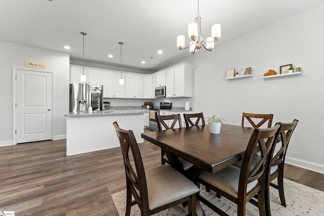 dining space with recessed lighting, dark wood finished floors, baseboards, and a chandelier