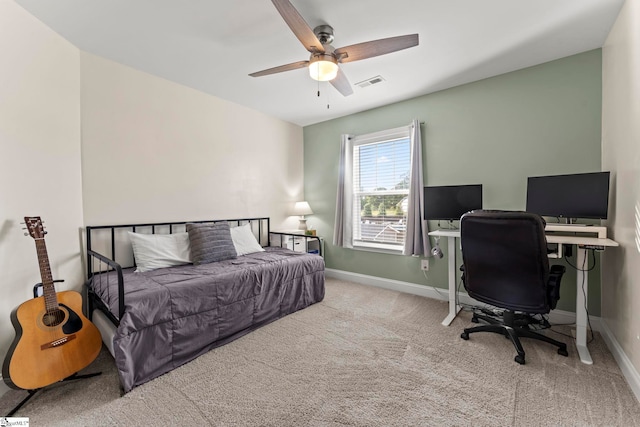 bedroom with carpet flooring, baseboards, an office area, and ceiling fan