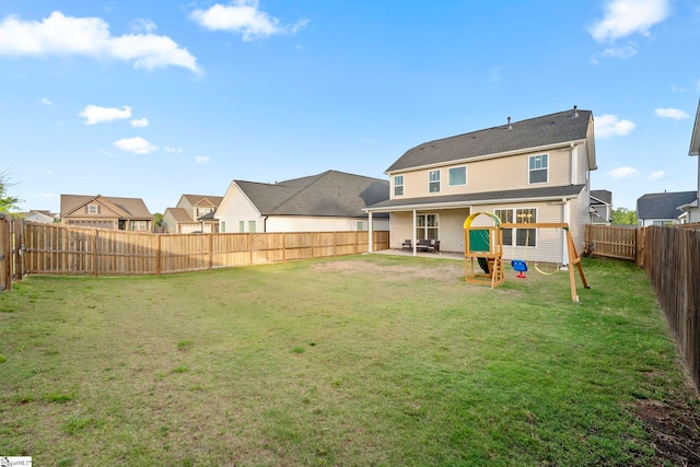 rear view of house with a patio area and a residential view