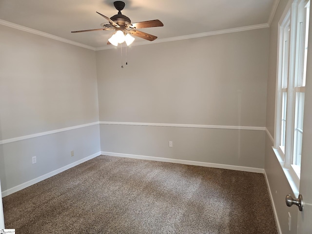 carpeted spare room with a ceiling fan, baseboards, and ornamental molding
