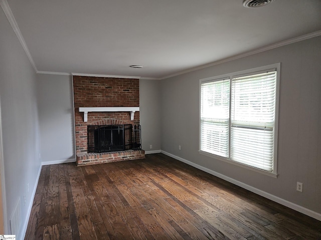unfurnished living room with dark wood-type flooring, baseboards, a brick fireplace, and crown molding