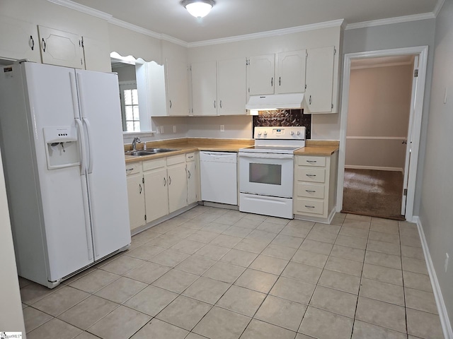kitchen with white appliances, under cabinet range hood, a sink, white cabinets, and crown molding