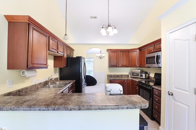 204 Silver Run Ln, Greenville, SC 29607 - kitchen with stainless steel appliances, a chandelier, a sink, a peninsula, and hanging light fixtures