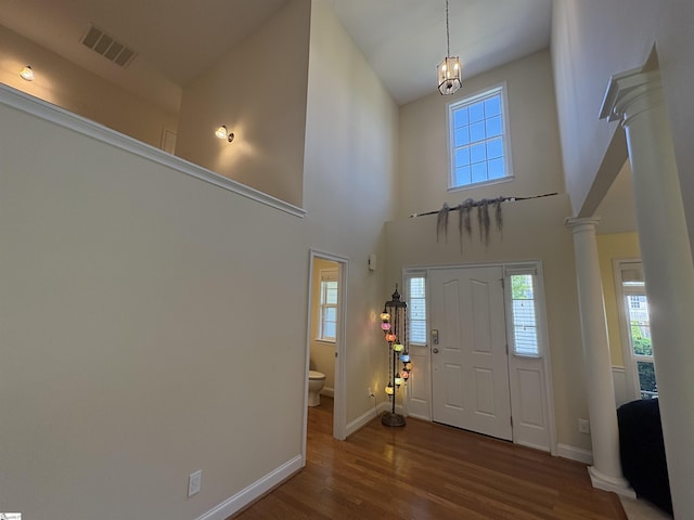 204 Silver Run Ln, Greenville, SC 29607 - foyer entrance featuring ornate columns, wood finished floors, baseboards, and a high ceiling