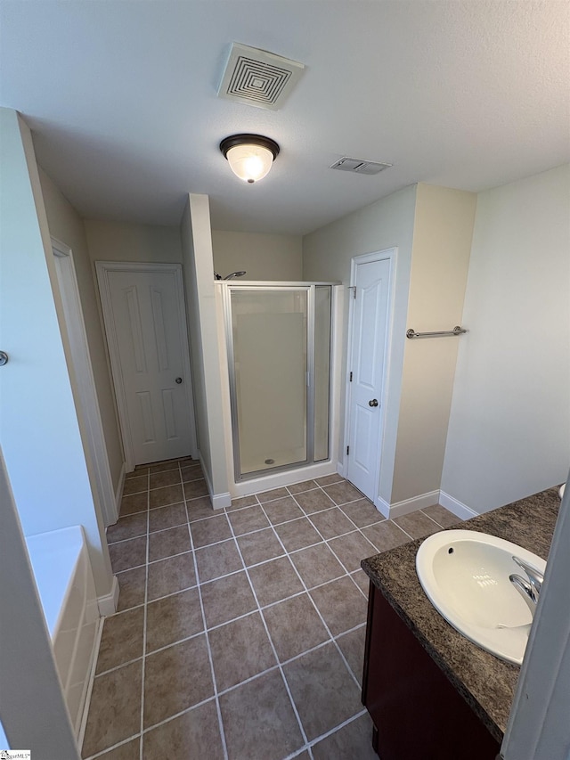 204 Silver Run Ln, Greenville, SC 29607 - bathroom featuring vanity, a shower stall, tile patterned flooring, and baseboards