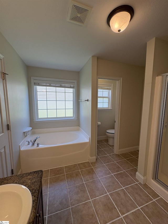204 Silver Run Ln, Greenville, SC 29607 - bathroom featuring vanity, a garden tub, toilet, tile patterned floors, and baseboards