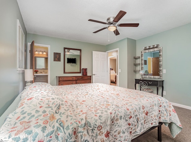 1312 Anderson Hwy, Easley, SC 29642 - bedroom with carpet flooring, baseboards, a ceiling fan, and connected bathroom