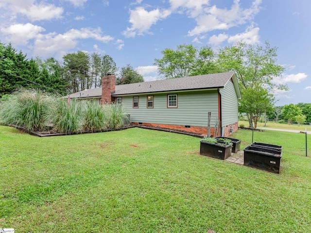 1312 Anderson Hwy, Easley, SC 29642 - back of house featuring crawl space, a lawn, a chimney, and a shingled roof