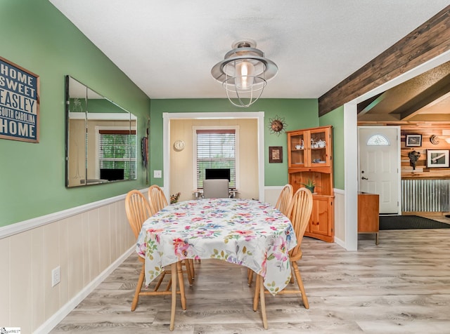 1312 Anderson Hwy, Easley, SC 29642 - dining area featuring wood finished floors, a wainscoted wall, and beamed ceiling
