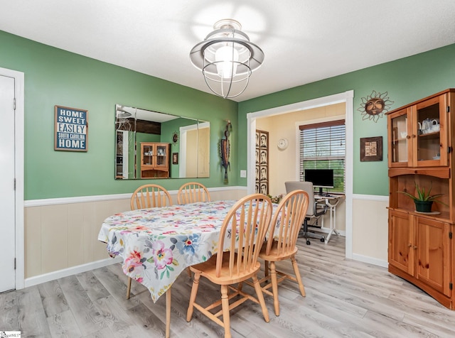 1312 Anderson Hwy, Easley, SC 29642 - dining room with light wood-style flooring and a wainscoted wall