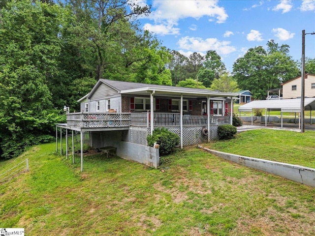 202 Vermont Dr, Gaffney, SC 29341 - back of property with a carport, a yard, and covered porch