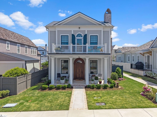 114 Burrough St, Greenville, SC 29615 - neoclassical home with a porch, a balcony, and a chimney