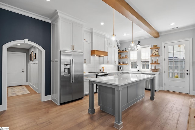 114 Burrough St, Greenville, SC 29615 - kitchen featuring stainless steel appliances, open shelves, light countertops, arched walkways, and decorative backsplash