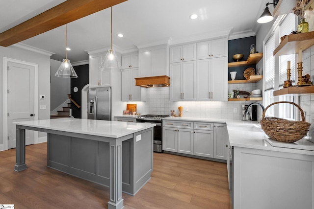 114 Burrough St, Greenville, SC 29615 - kitchen featuring appliances with stainless steel finishes, open shelves, ornamental molding, decorative backsplash, and light wood-type flooring