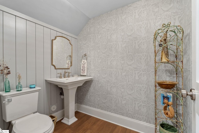 114 Burrough St, Greenville, SC 29615 - half bathroom featuring vaulted ceiling, wood finished floors, toilet, and wallpapered walls