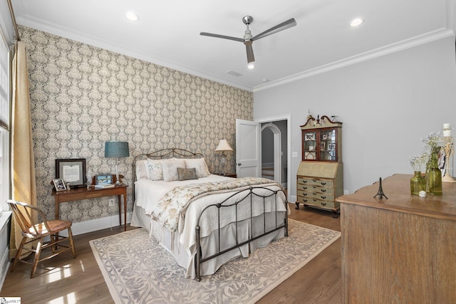 114 Burrough St, Greenville, SC 29615 - bedroom featuring an accent wall, wallpapered walls, wood finished floors, crown molding, and recessed lighting