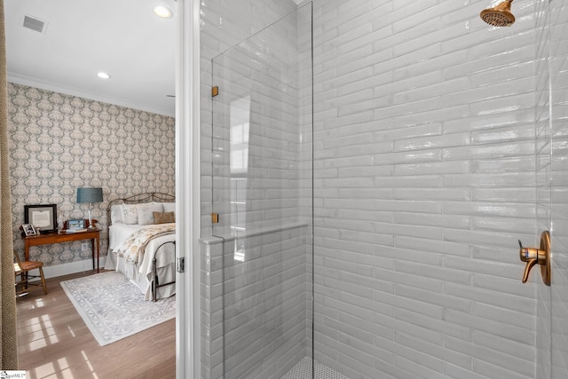 114 Burrough St, Greenville, SC 29615 - ensuite bathroom featuring wallpapered walls, tiled shower, wood finished floors, crown molding, and recessed lighting