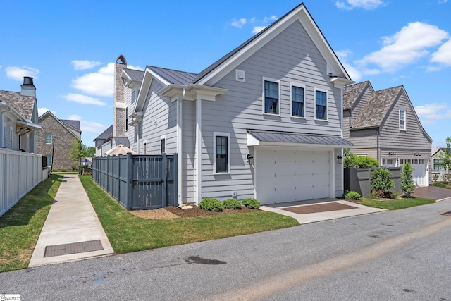 114 Burrough St, Greenville, SC 29615 - traditional-style house with a standing seam roof, fence, metal roof, and a garage
