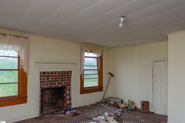 156 Spencer Rd, Jonesville, SC 29653 - unfurnished living room with a brick fireplace