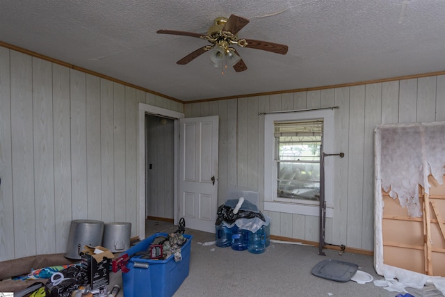 156 Spencer Rd, Jonesville, SC 29653 - game room featuring crown molding, wood walls, a ceiling fan, carpet floors, and baseboards